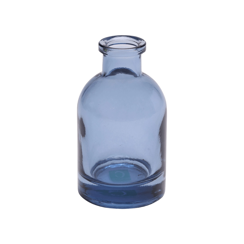 Chive Loft tall glass bud vase in medium blue with a slender neck and rounded shoulder.