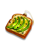 Chive glass avocado toast ornament with sliced avocado and seed sprinkle.