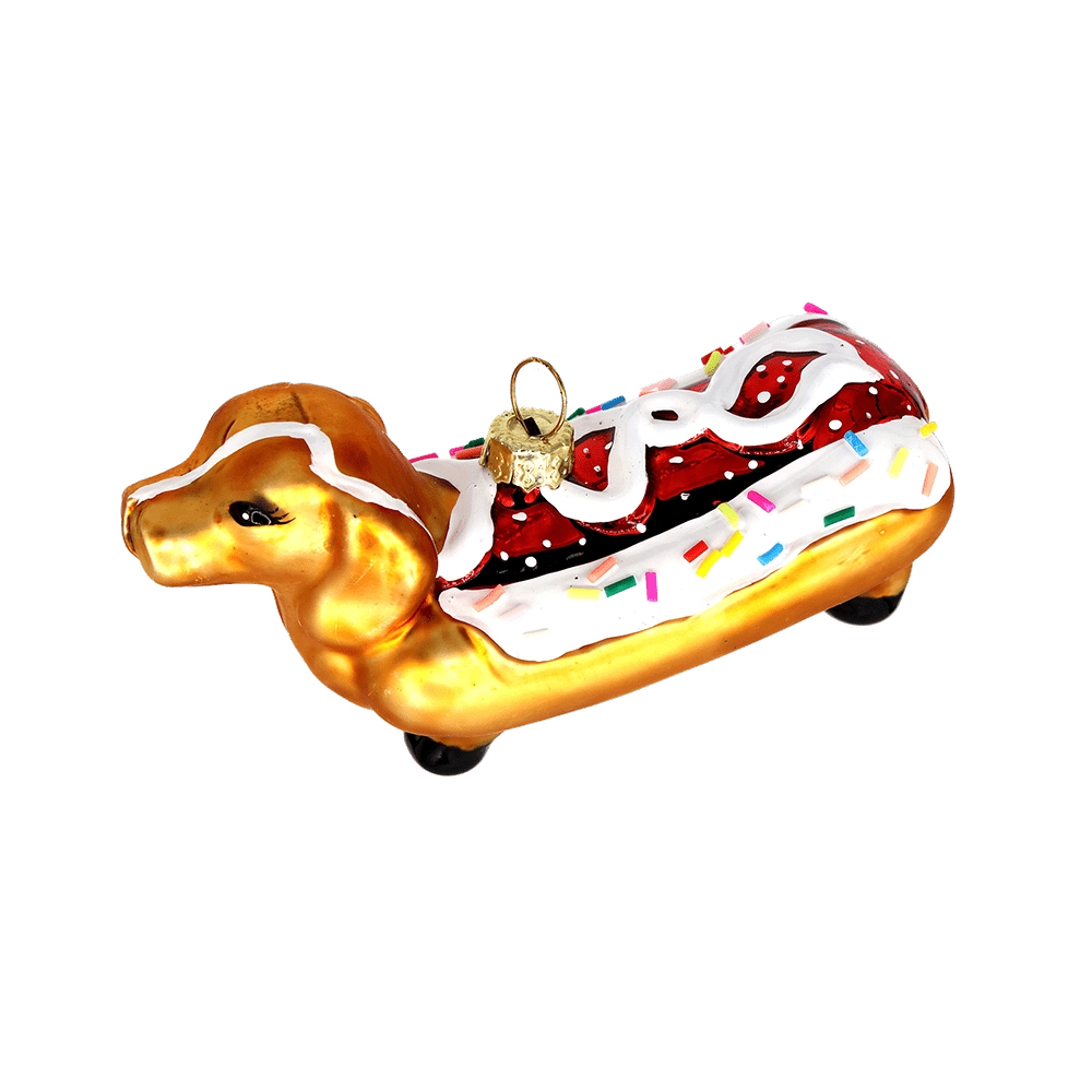 Chive glass dachshund ornament shown at an angle highlighting the sprinkled icing.