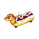 Chive glass dachshund ornament shown at an angle highlighting the sprinkled icing.