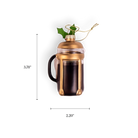 Chive glass French press ornament in gold with a holly leaf accent.