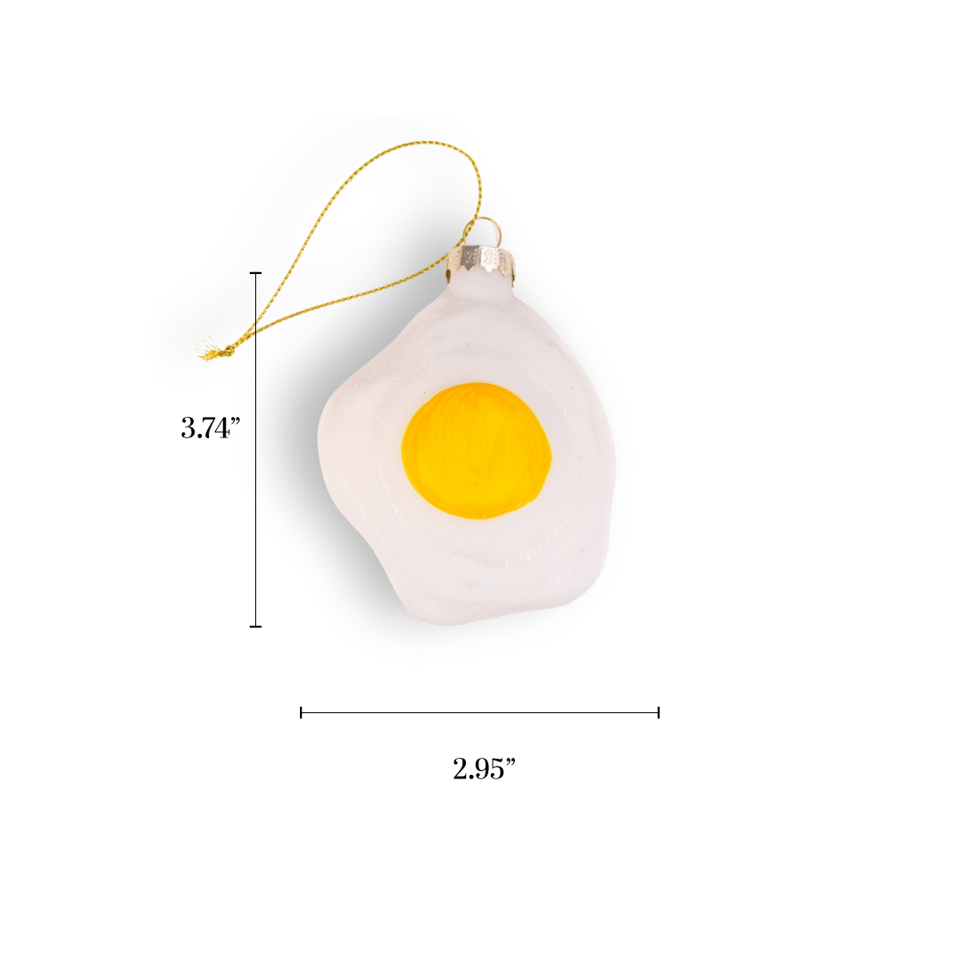 Chive glass fried egg ornament with a bright yellow yolk and white edge.
