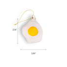 Chive glass fried egg ornament with a bright yellow yolk and white edge.