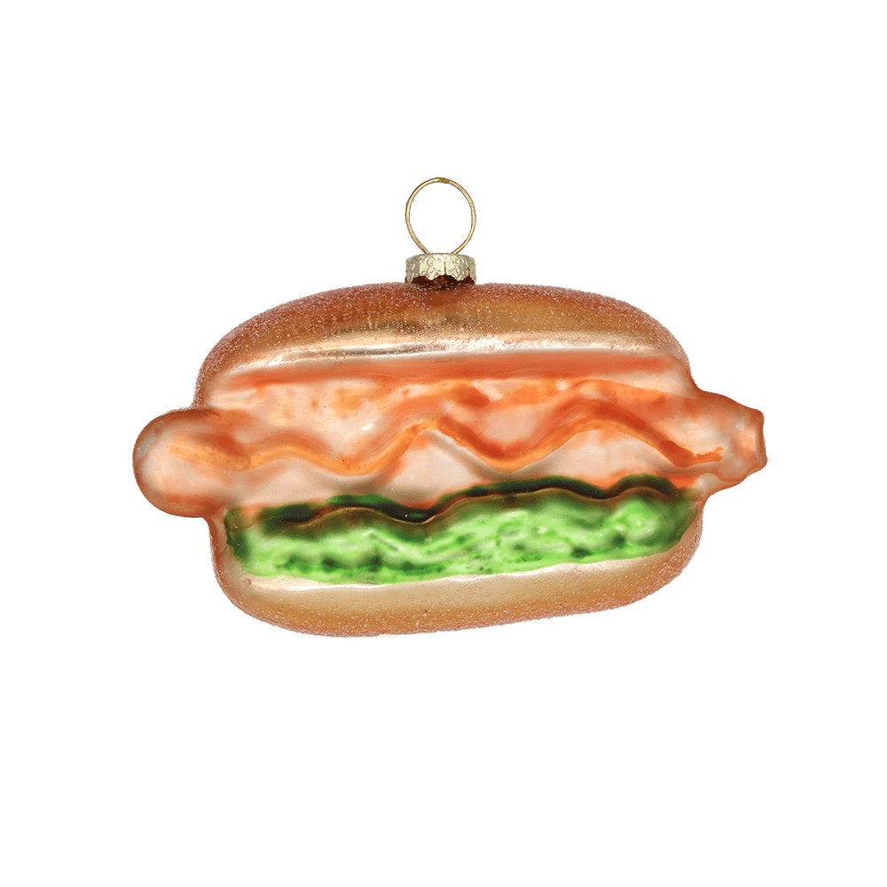 Chive glass hot dog ornament with ketchup and relish detail on a soft bun.