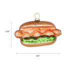 Chive glass hot dog ornament with a dimension diagram showing its wide bun shape.