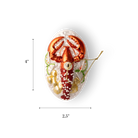 Chive glass lobster ornament on a plate with red claws and beaded garnish.
