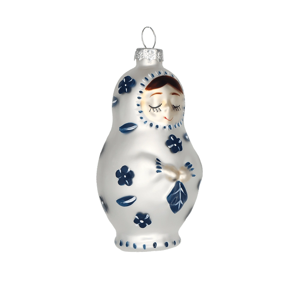 Chive glass matryoshka doll ornament in white with navy floral folk art detail.