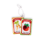 Chive glass seed packet ornament in orange and green with glitter accents.