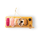 Chive glass sushi board ornament, overhead view of assorted nigiri toppings.