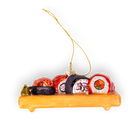Chive glass sushi platter ornament on a wood-tone tray with rolls.