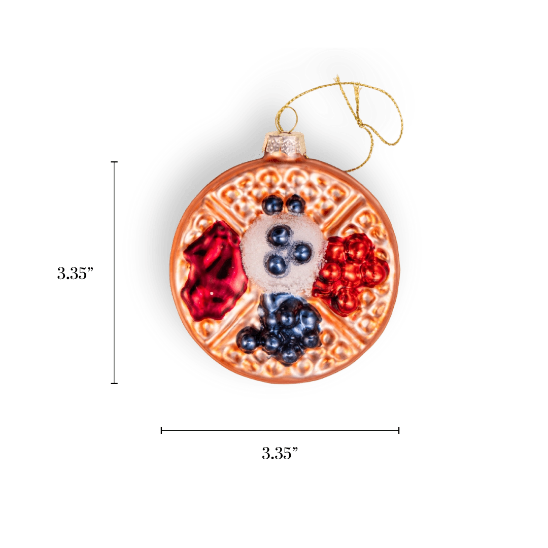 Chive glass waffle ornament in golden brown with mixed berry toppings.