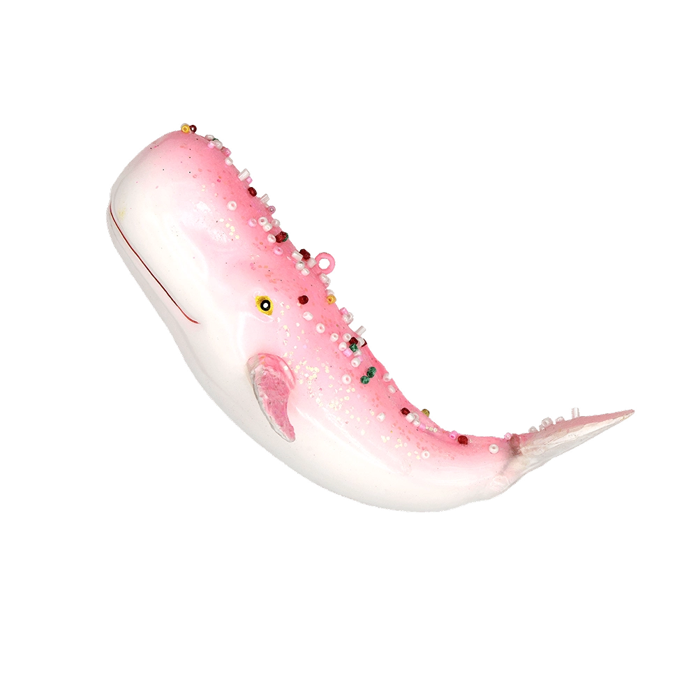 Chive glass whale ornament in pink with a jeweled beaded spine and glitter accents.