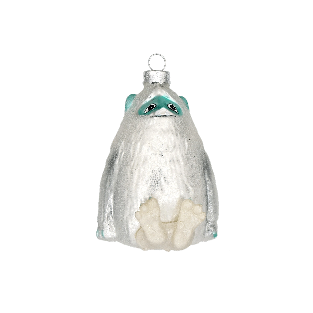 Chive glass yeti ornament in white with a teal face mask and textured fur detail.