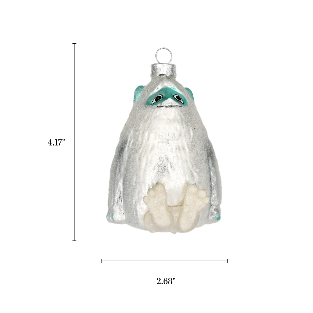Chive glass yeti ornament with a dimension diagram showing its rounded sitting size.