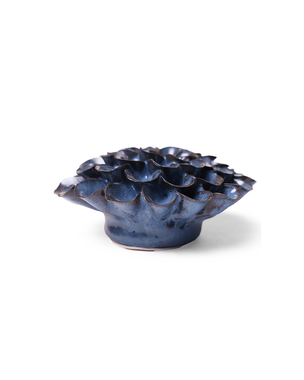 A small sculptural ceramic vessel with a ruffled, lotus-like top and a rounded base, shown on a clean white background. The glaze is predominantly deep blue with dark brown and black variation along the edges and highlights.