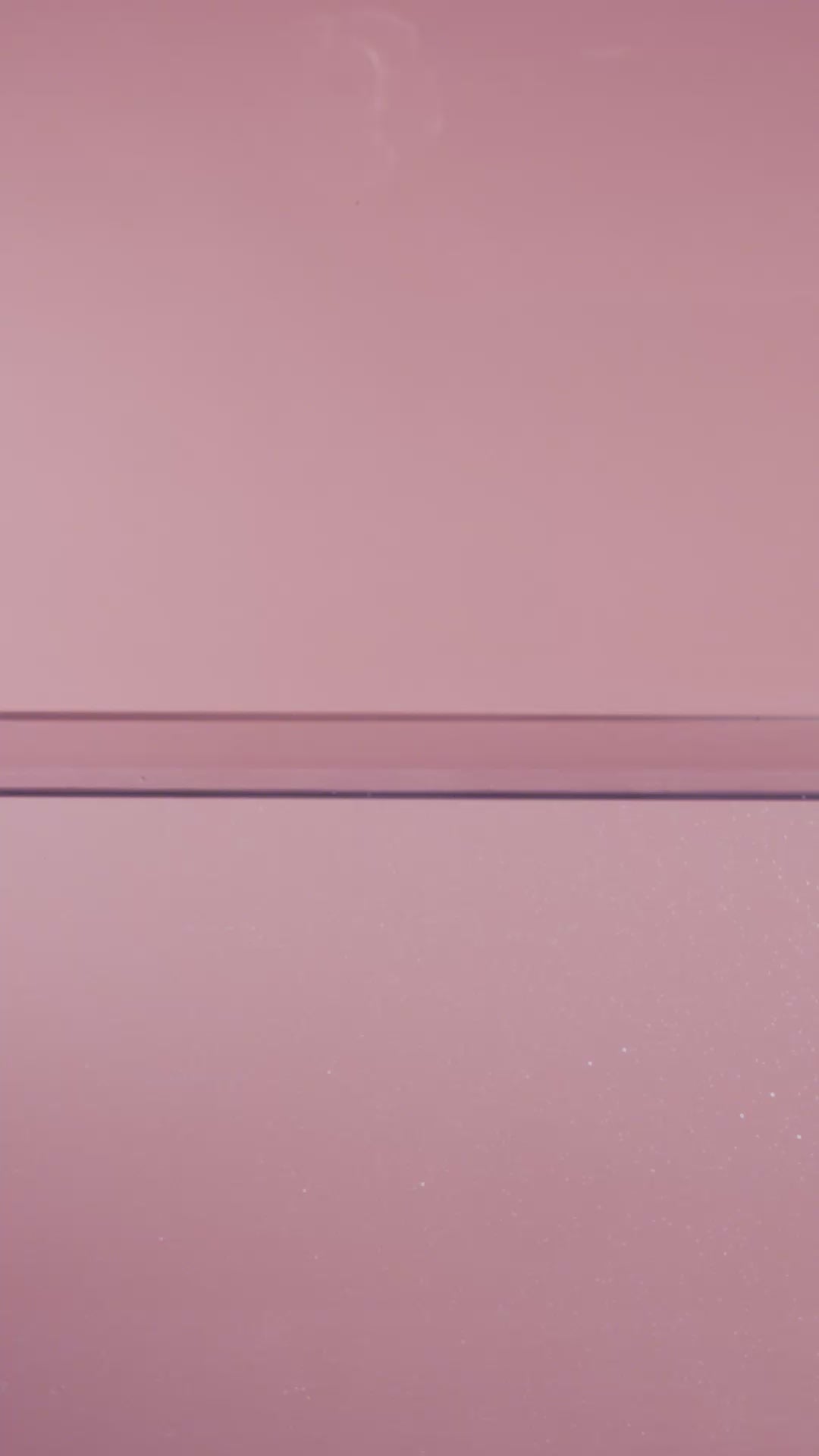 Blush pink elegance ranunculus ceramic wall flower plunging into still water creating a dramatic slow motion splash — France Collection — Chive Studio