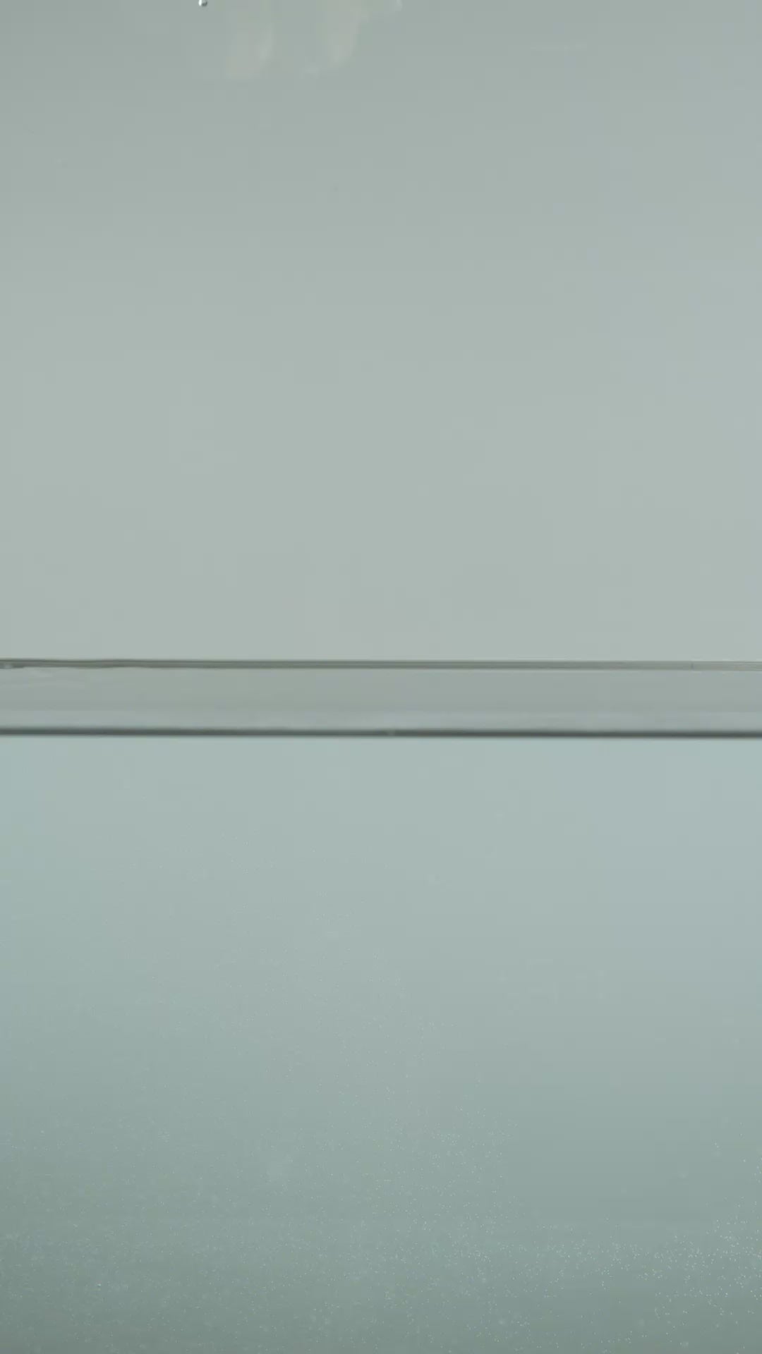 Buttercup yellow hawthorn ceramic wall flower plunging into still water creating a dramatic slow motion splash — English Garden Collection — Chive Studio