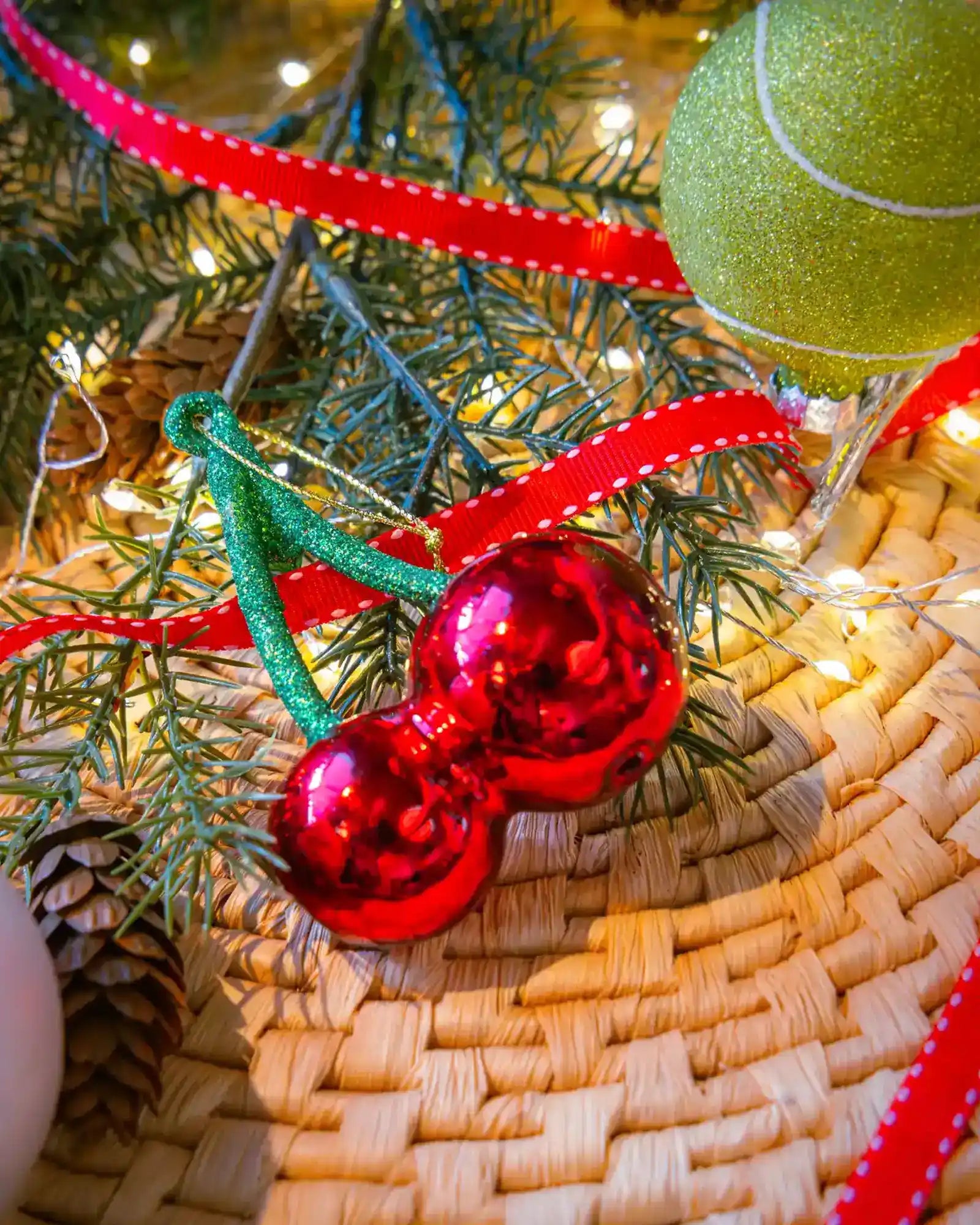 Cherries ornament styled on a decorated Christmas tree