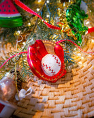 Baseball glove ornament styled on a decorated Christmas tree