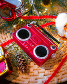 Red Boombox ornament styled on a decorated Christmas tree