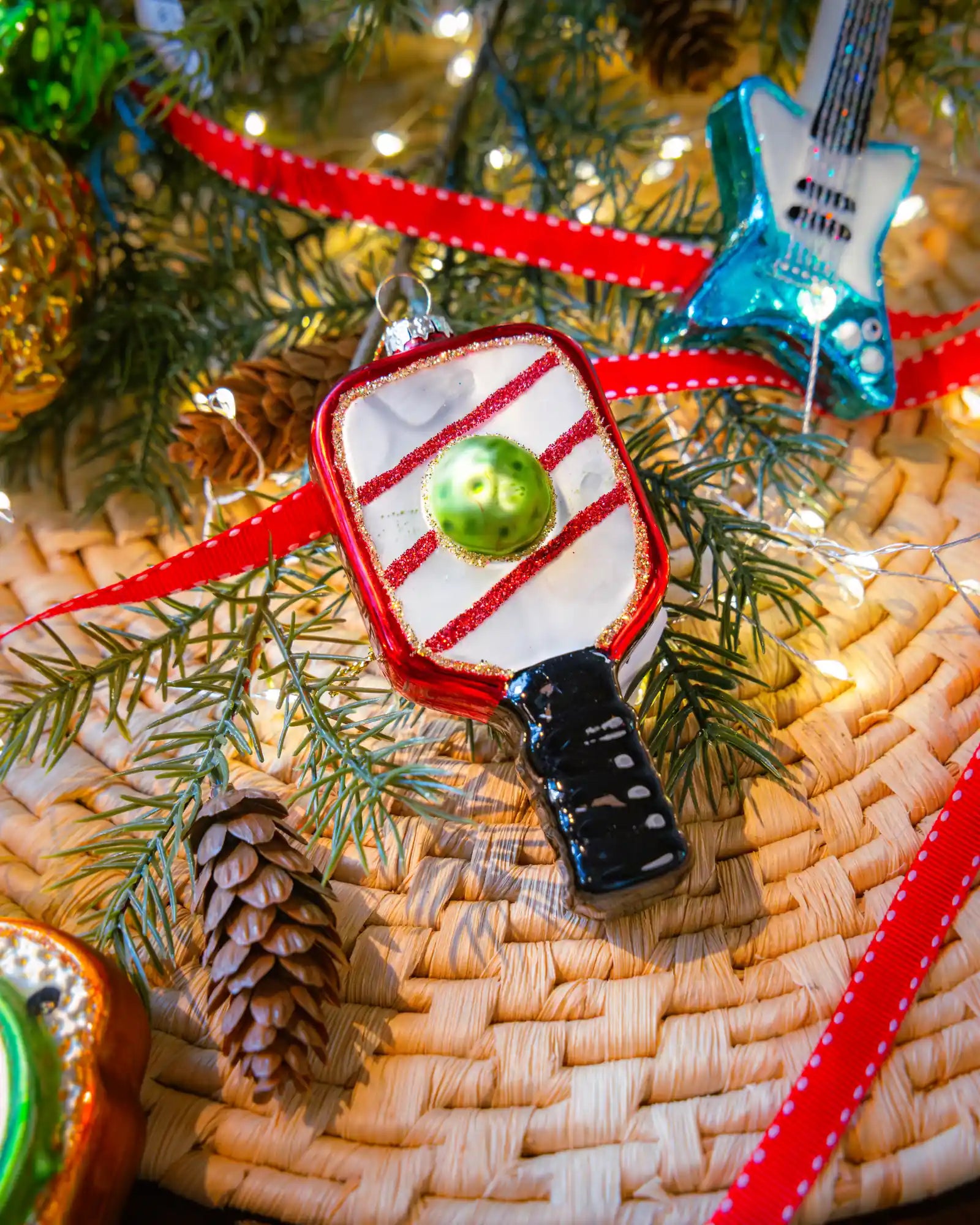 Pickleball ornament styled on a decorated Christmas tree
