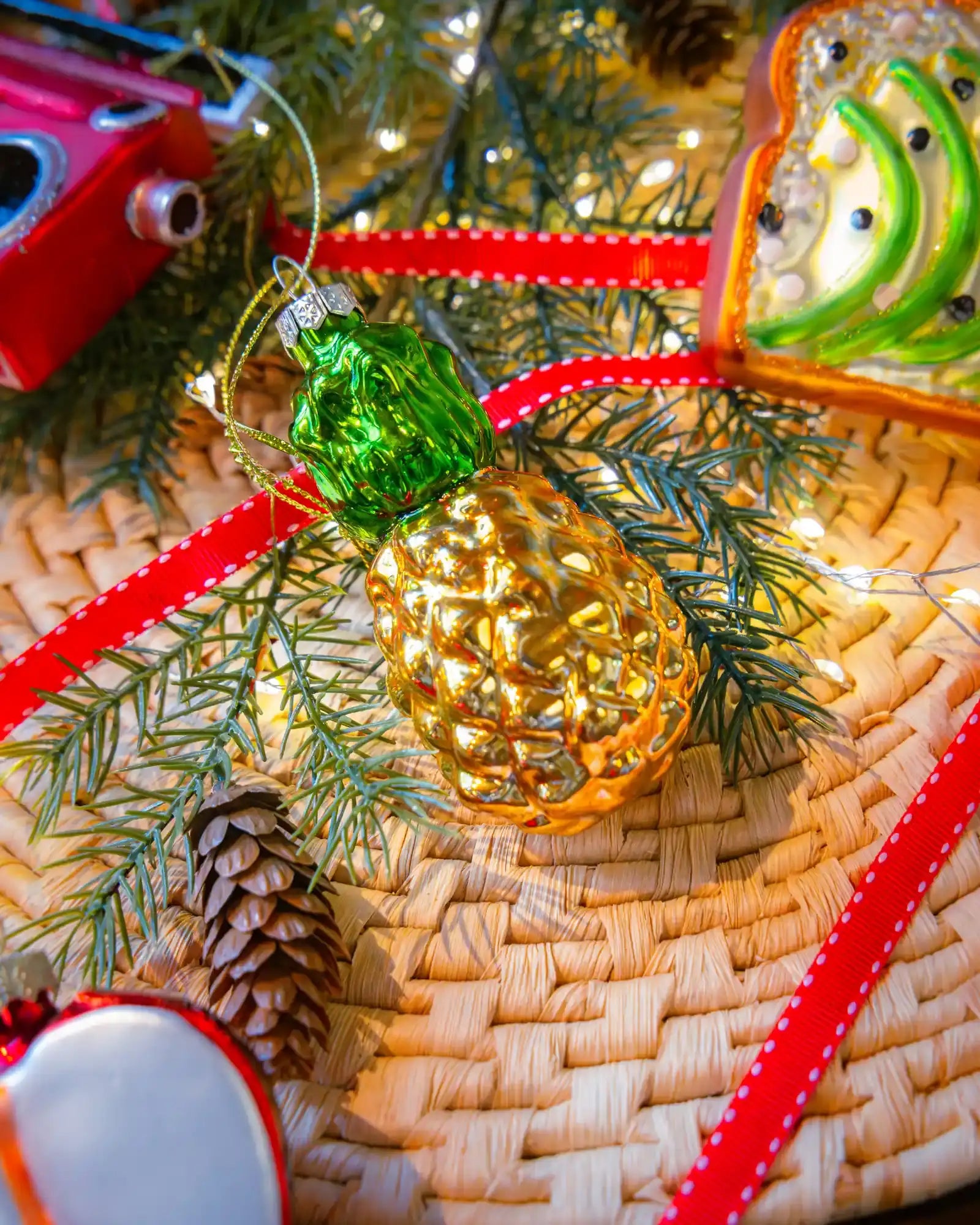 Pineapple ornament styled on a decorated Christmas tree
