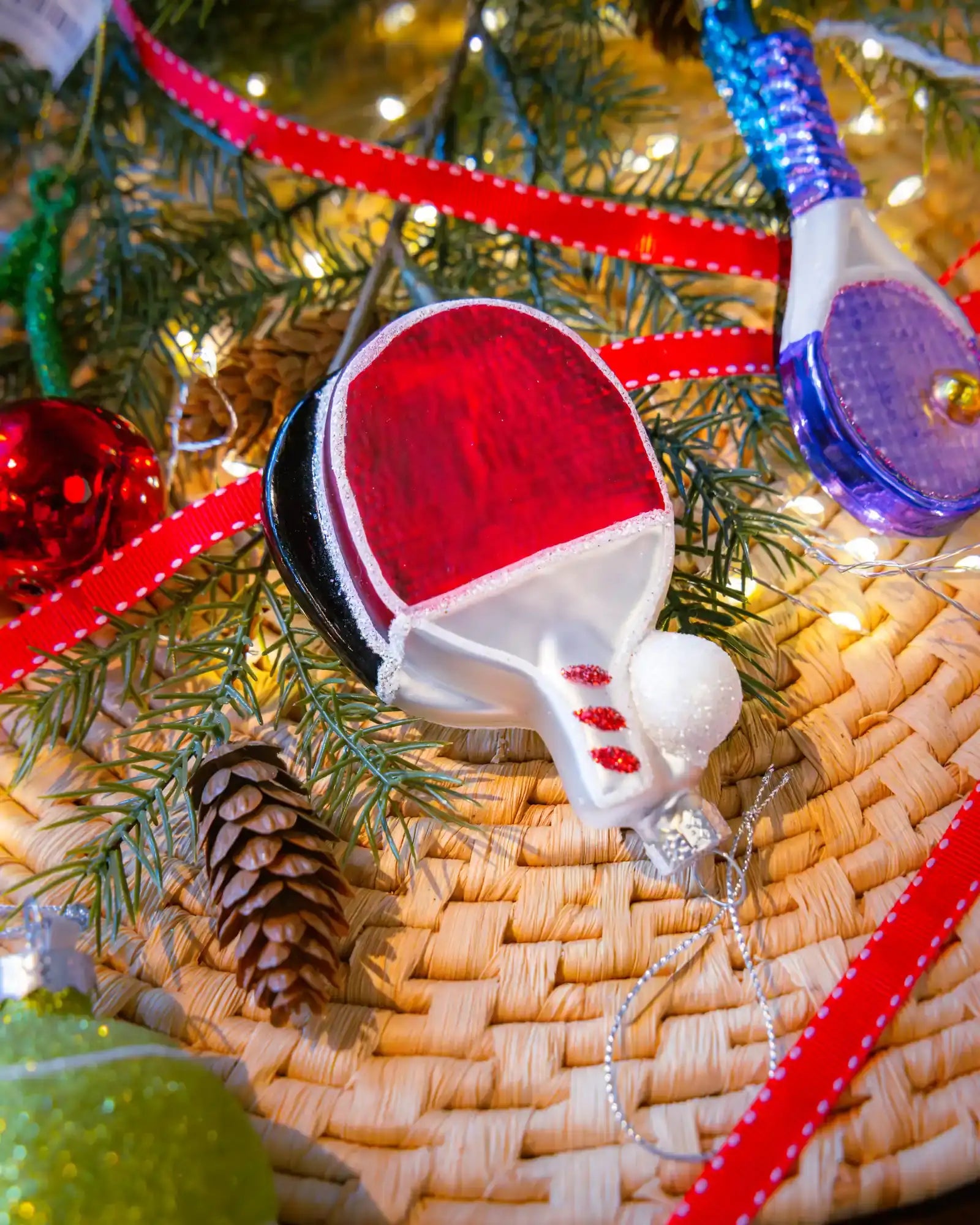 Ping Pong ornament styled on a decorated Christmas tree
