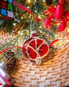 Pomegranate ornament styled on a decorated Christmas tree