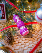 Purple Poodle ornament styled on a decorated Christmas tree
