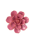 A single artificial-looking flower with layered petals in a dusty rose pink color, outlined with a thin metallic gold edge, isolated on a solid black background.